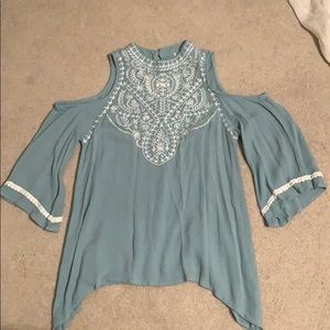 blue blouse with white detailing